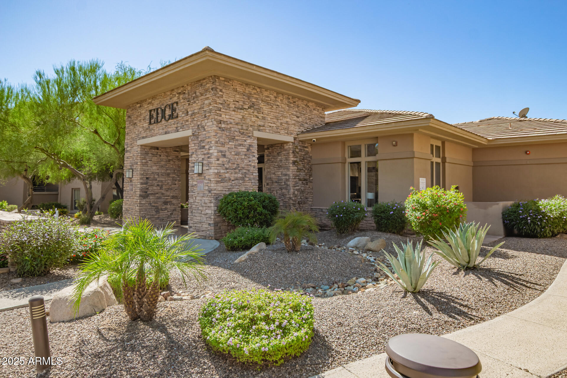 20100 North 78th Place, Unit 2083 Scottsdale, AZ 85255 - Photo 31 of 40 a front view of a house with a yard