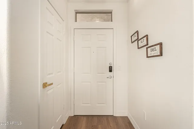 a view of a patio with couches table and chairs and potted plants