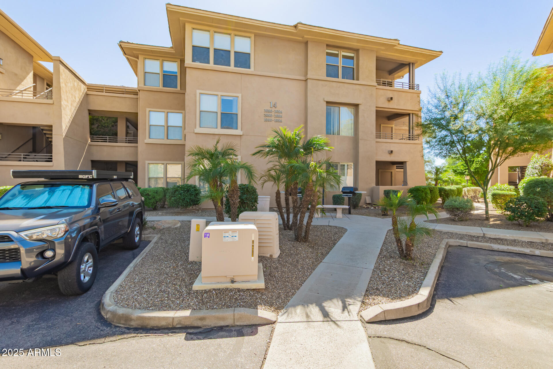 20100 North 78th Place, Unit 2083 Scottsdale, AZ 85255 - Photo 38 of 40 a view of a patio with couches table and chairs and potted plants