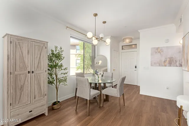 a view of a dining room with furniture window and wooden floor