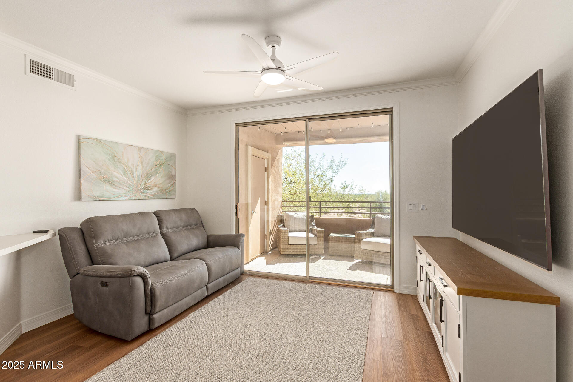 20100 North 78th Place, Unit 2083 Scottsdale, AZ 85255 - Photo 5 of 40 a living room with furniture and a flat screen tv