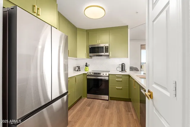 a kitchen with a sink and a refrigerator