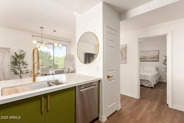 a en suite bathroom with a sink and a mirror