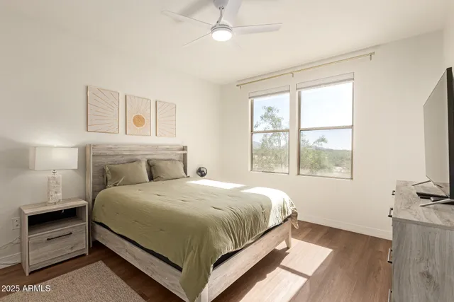 a bedroom with a bed and window