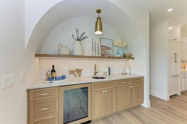 a kitchen that has a table chairs and wooden floor