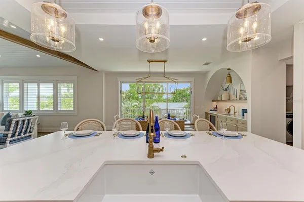 a spacious bathroom with a double vanity sink a mirror and a bathtub