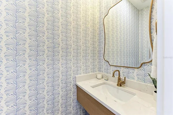a white bath tub sitting in a bathroom