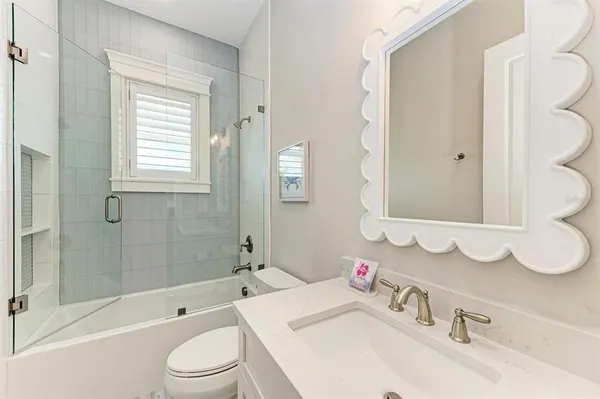 a bedroom with bed and window