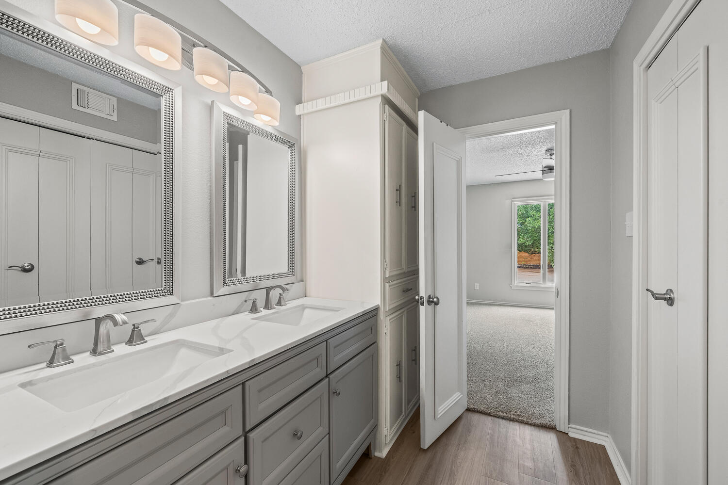 2302 Slide Road, Unit 35 Lubbock, TX 79407 - Photo 20 of 43 a bathroom with a sink and a mirror