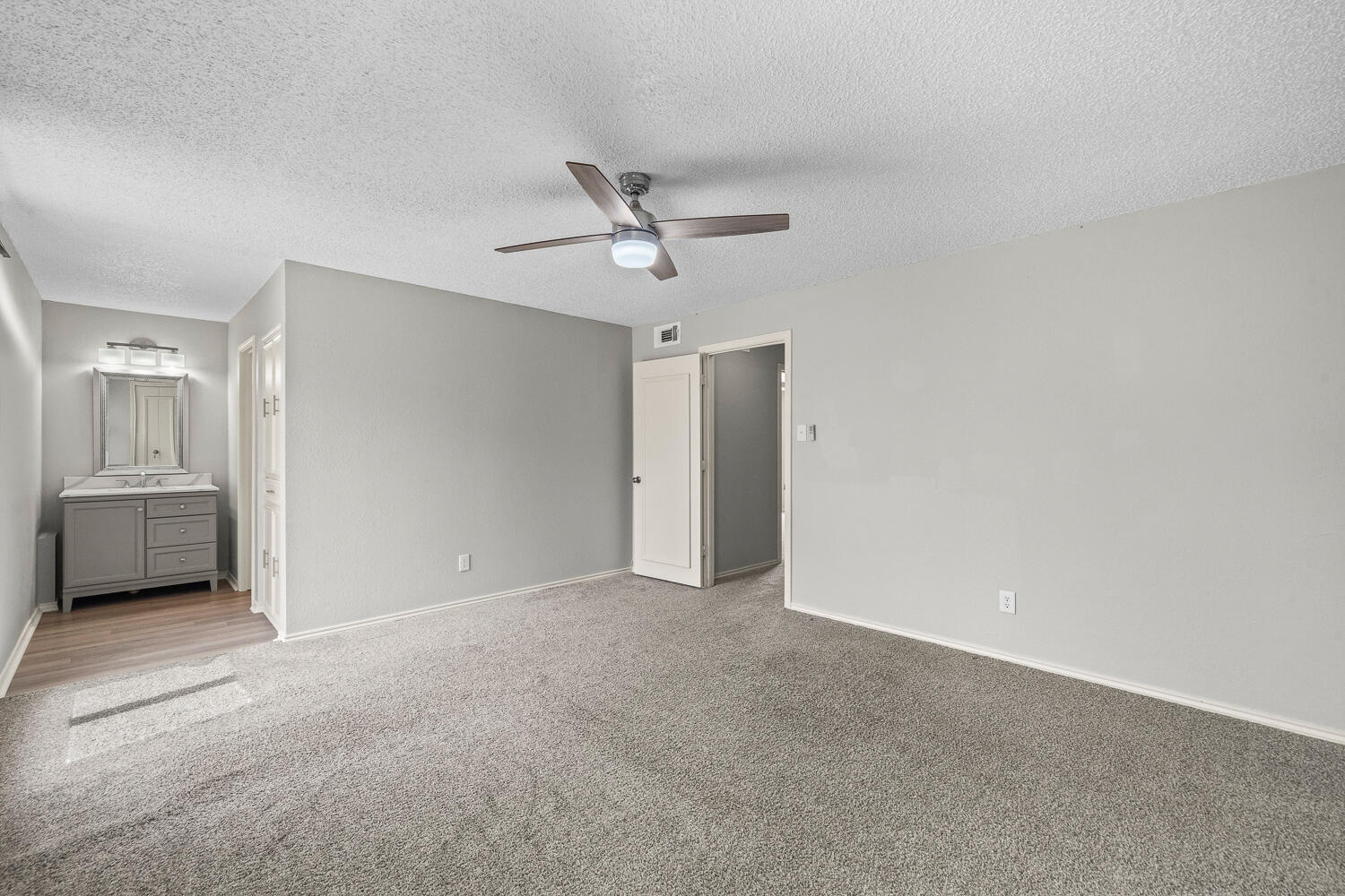 2302 Slide Road, Unit 35 Lubbock, TX 79407 - Photo 31 of 43 a view of a livingroom with a ceiling fan and window