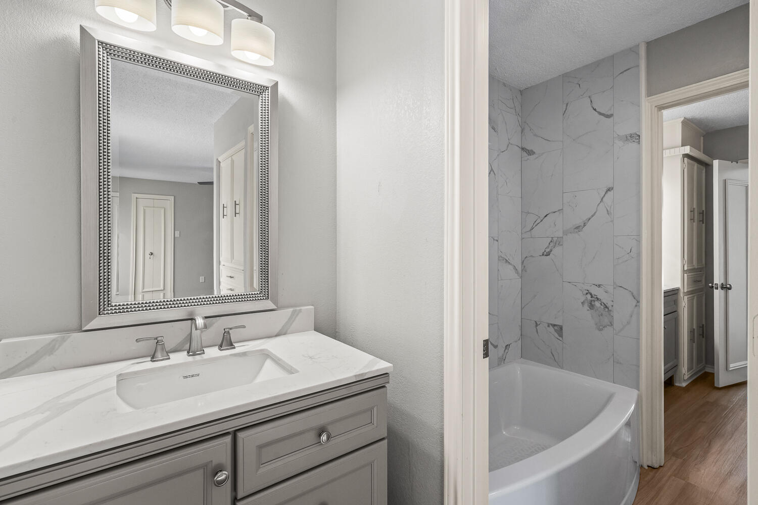 2302 Slide Road, Unit 35 Lubbock, TX 79407 - Photo 32 of 43 a bathroom with a bathtub and a sink