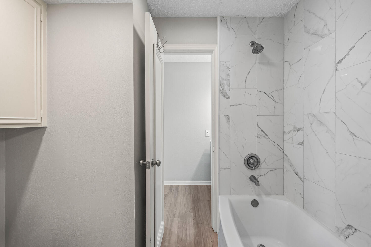 2302 Slide Road, Unit 35 Lubbock, TX 79407 - Photo 33 of 43 a bathroom with a bathtub