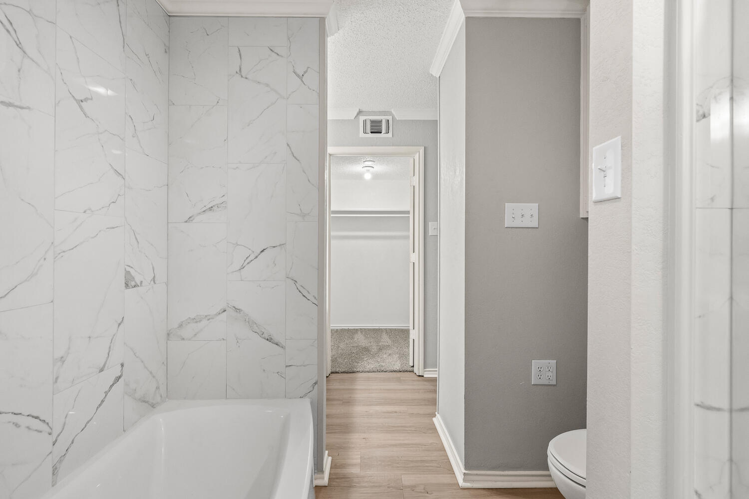 2302 Slide Road, Unit 35 Lubbock, TX 79407 - Photo 34 of 43 a bathroom with a bathtub and a shower