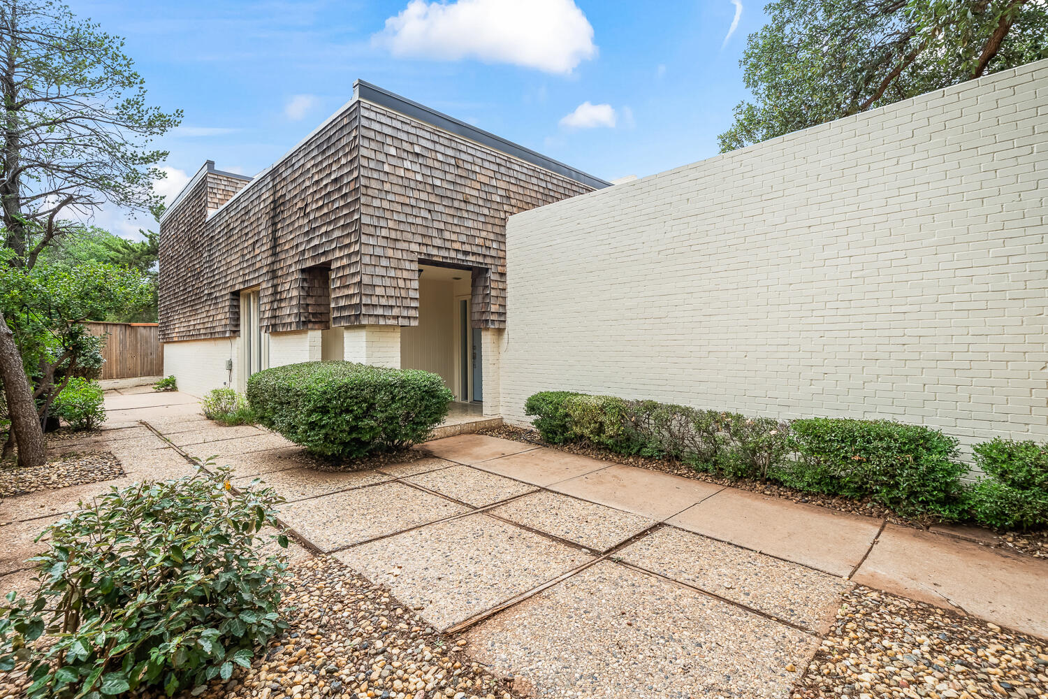 2302 Slide Road, Unit 35 Lubbock, TX 79407 - Photo 37 of 43 a view of a house with a backyard
