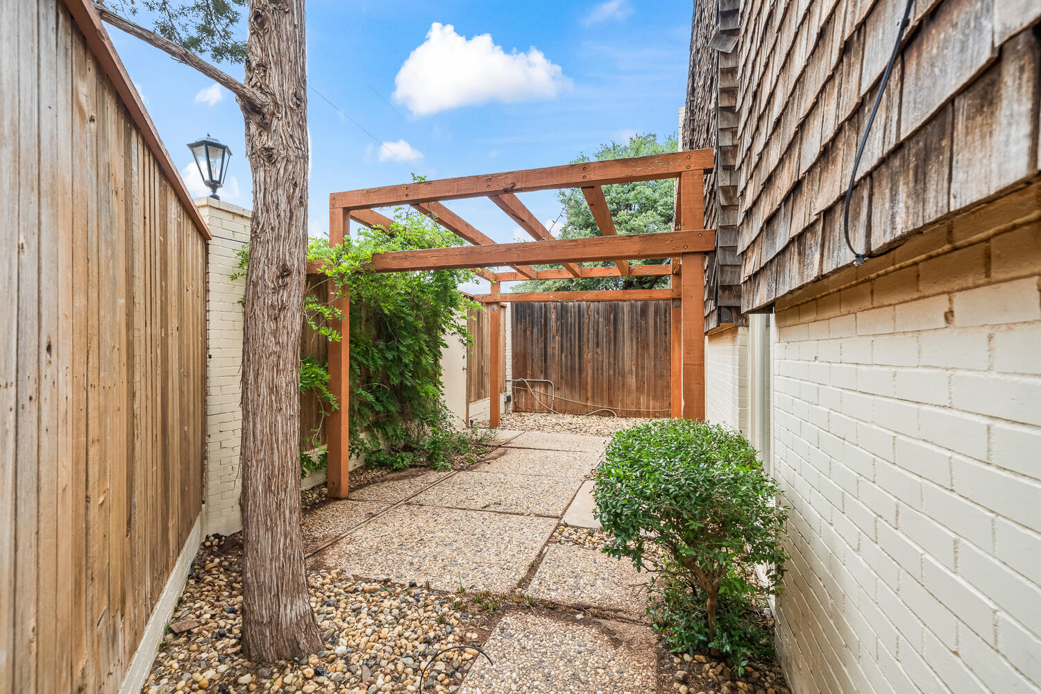 2302 Slide Road, Unit 35 Lubbock, TX 79407 - Photo 38 of 43 a view of a house with a garden