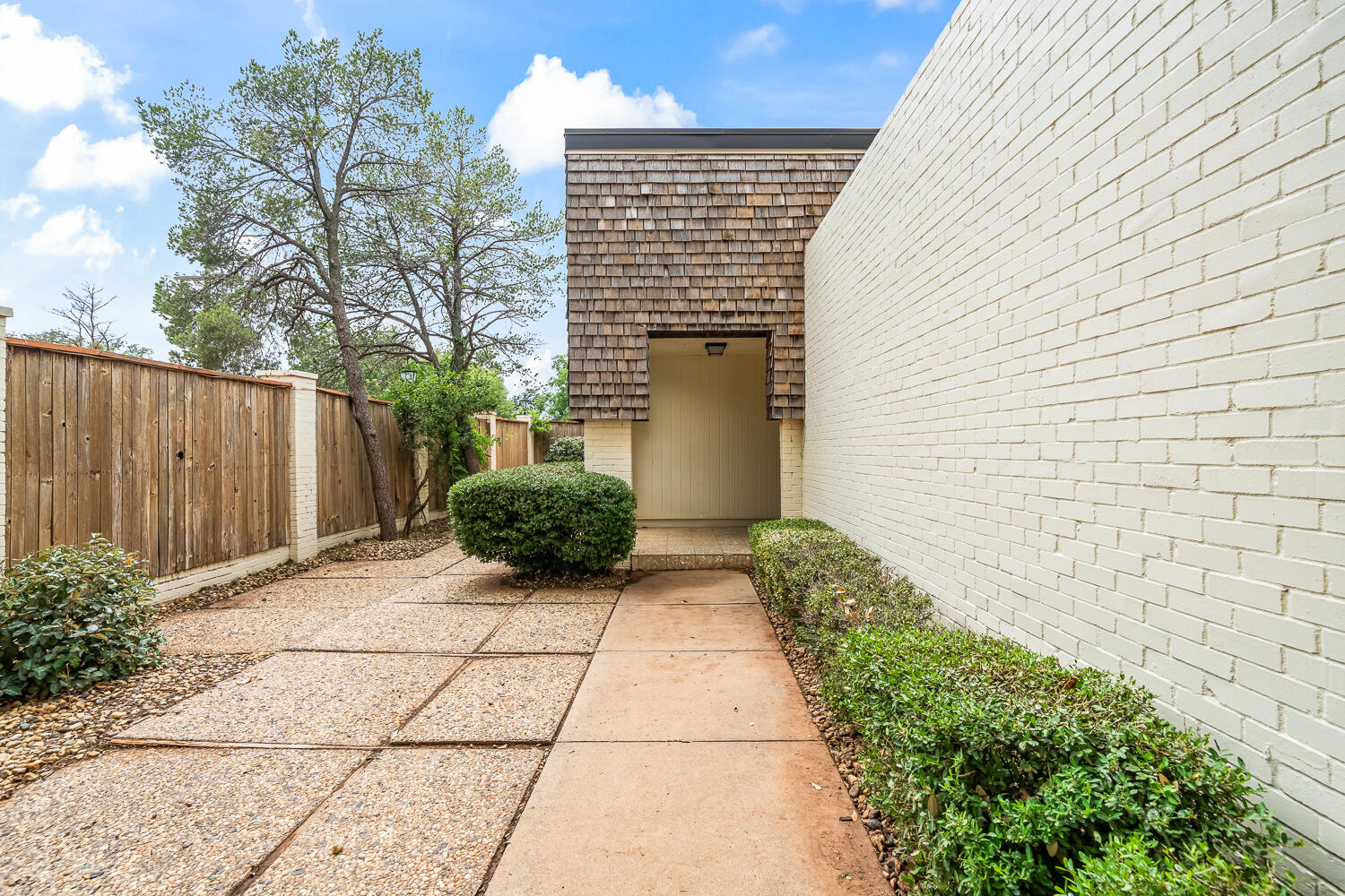 2302 Slide Road, Unit 35 Lubbock, TX 79407 - Photo 5 of 43 a view of backyard with pathway