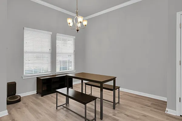 a view of a livingroom with furniture window and wooden floor