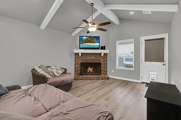 a bedroom with a bed and a fireplace
