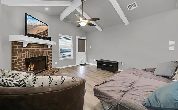 a living room with furniture and a fireplace