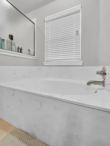 a bathroom with a sink and a bathtub