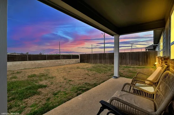 a view of backyard with a table and chair
