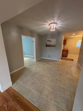 a view of an empty room with a window