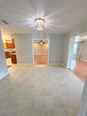 a kitchen with granite countertop sink and stainless steel appliances