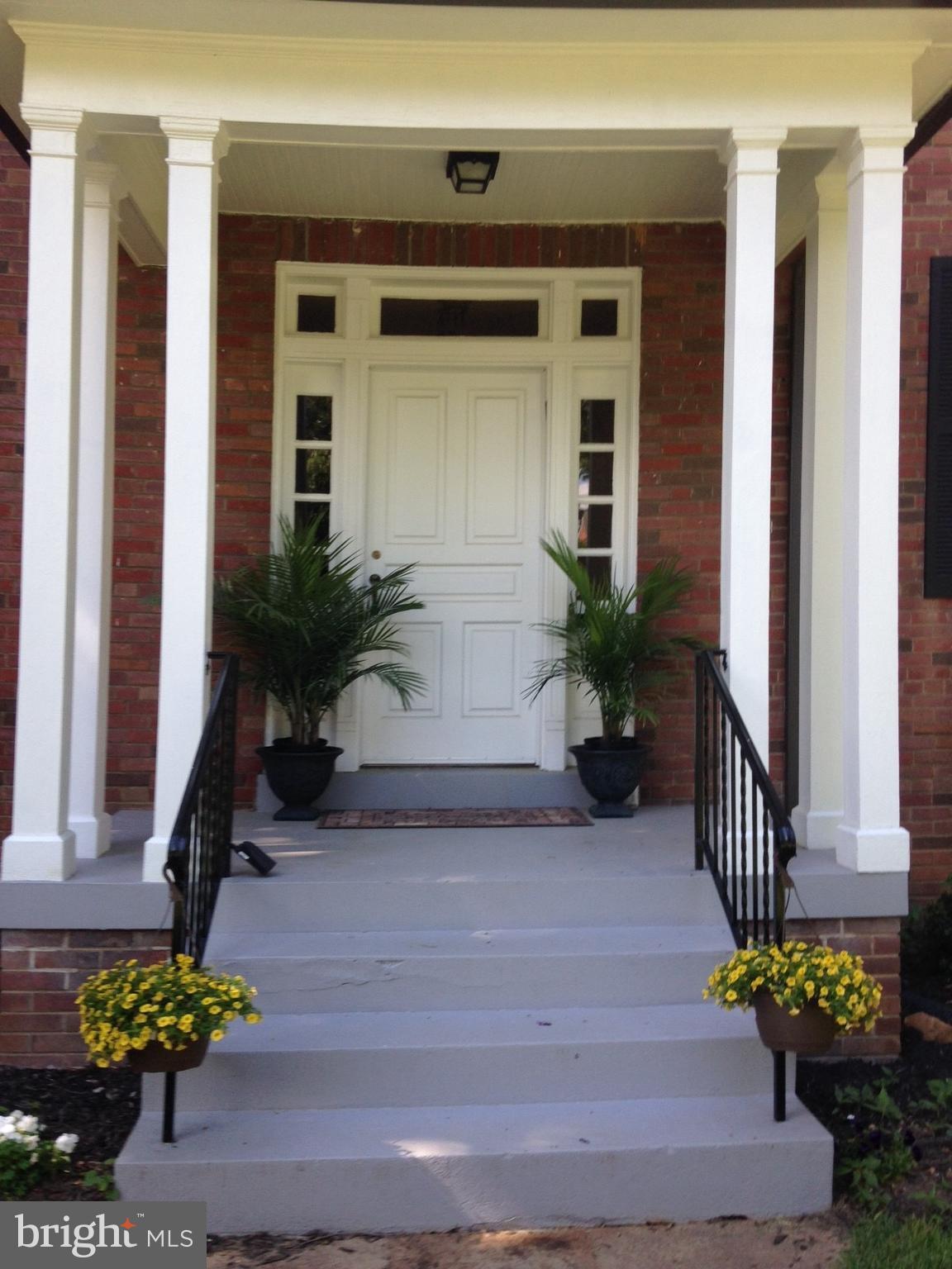 3111 Rittenhouse Street Northwest Washington, DC 20015 - Photo 2 of 30 a front view of a house with potted plants