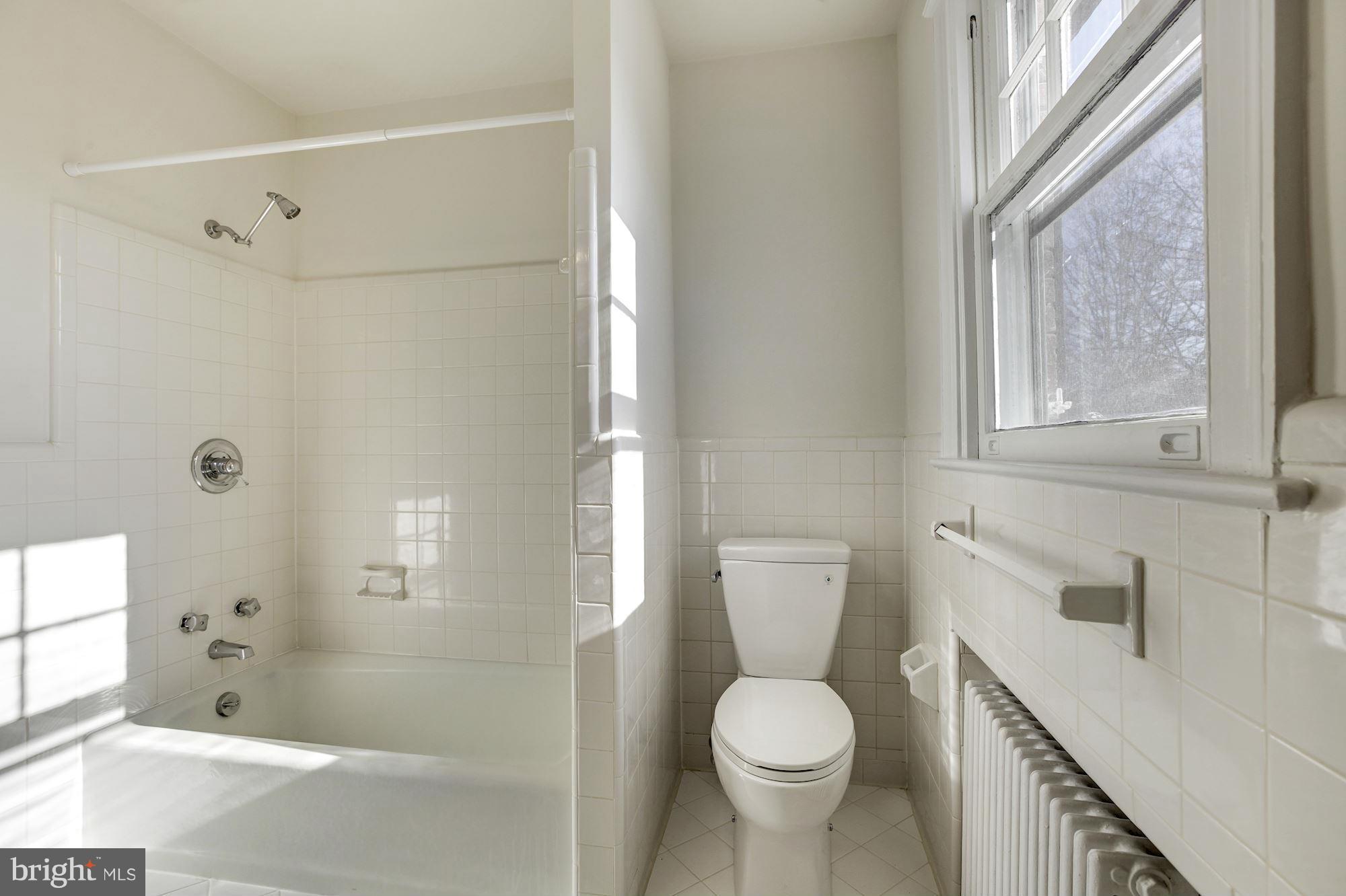 3111 Rittenhouse Street Northwest Washington, DC 20015 - Photo 15 of 30 a bathroom with a sink toilet and shower