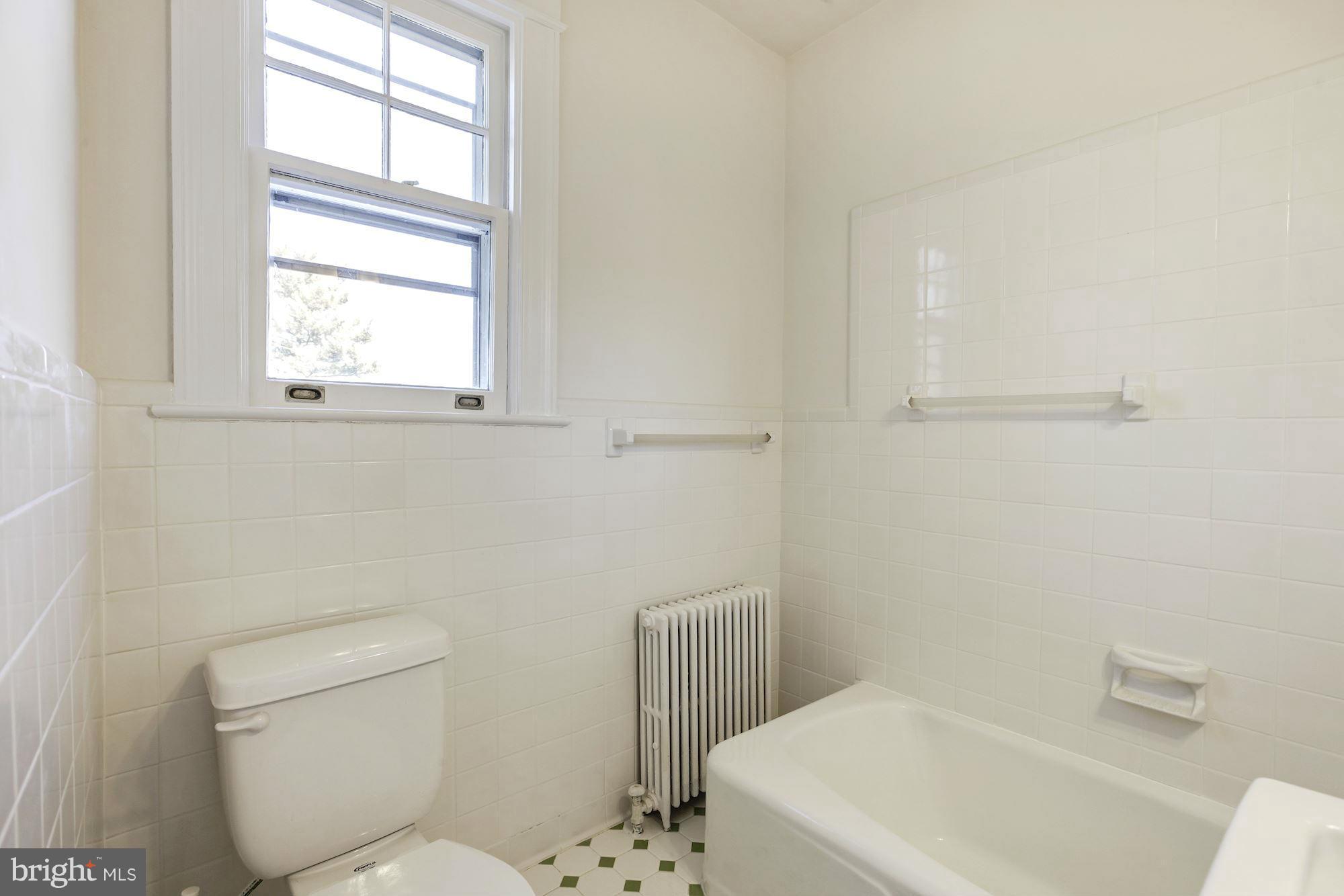 3111 Rittenhouse Street Northwest Washington, DC 20015 - Photo 20 of 30 a white toilet sitting next to a bathroom sink