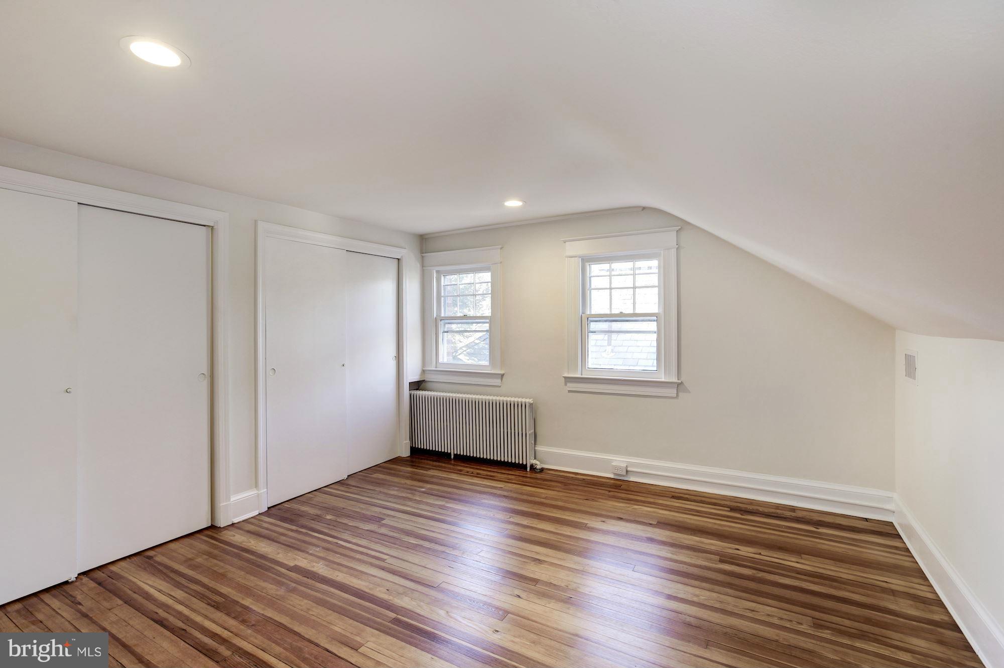 3111 Rittenhouse Street Northwest Washington, DC 20015 - Photo 22 of 30 a view of empty room with wooden floor and fan