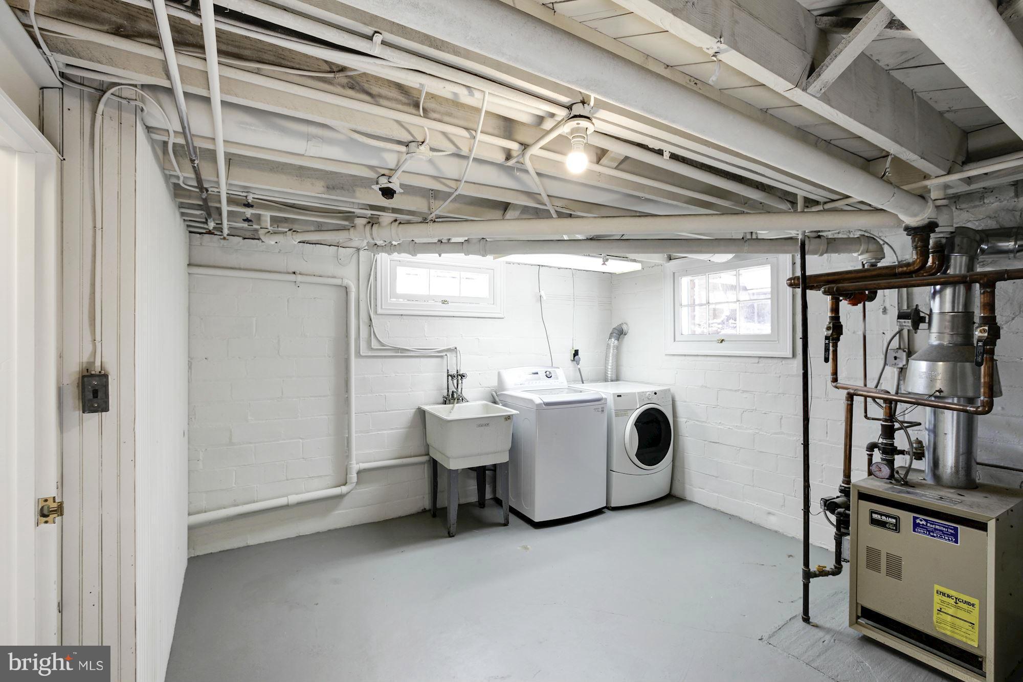 3111 Rittenhouse Street Northwest Washington, DC 20015 - Photo 28 of 30 a view of utility room with washer and dryer