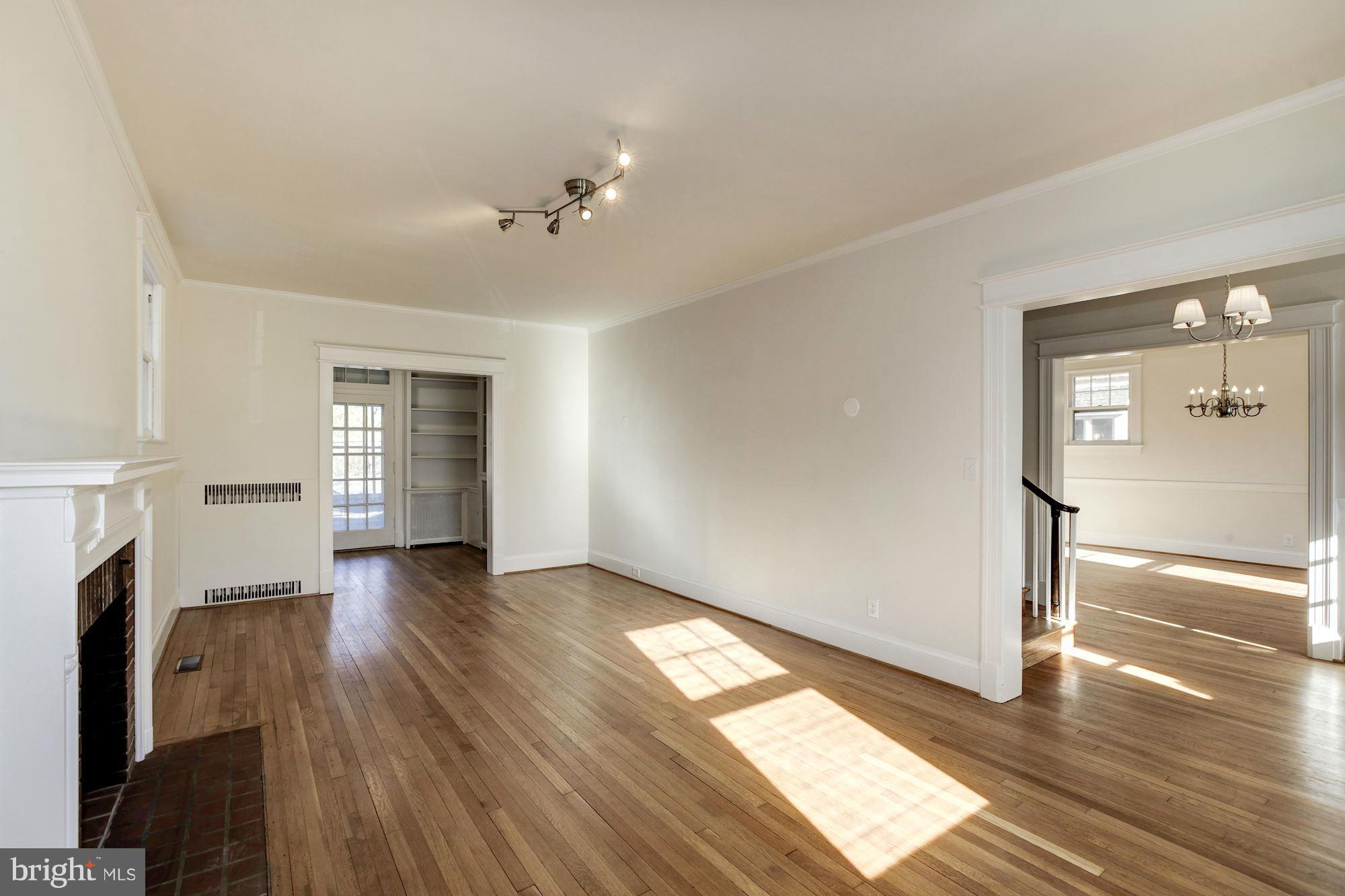 3111 Rittenhouse Street Northwest Washington, DC 20015 - Photo 6 of 30 a view of empty room with wooden floor and fan