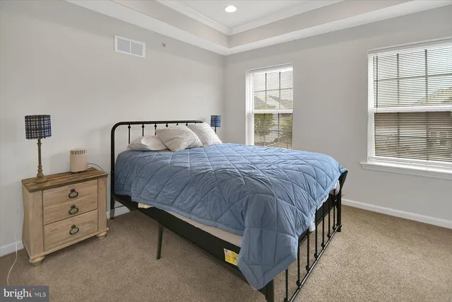a bedroom with a bed and a view of bathroom