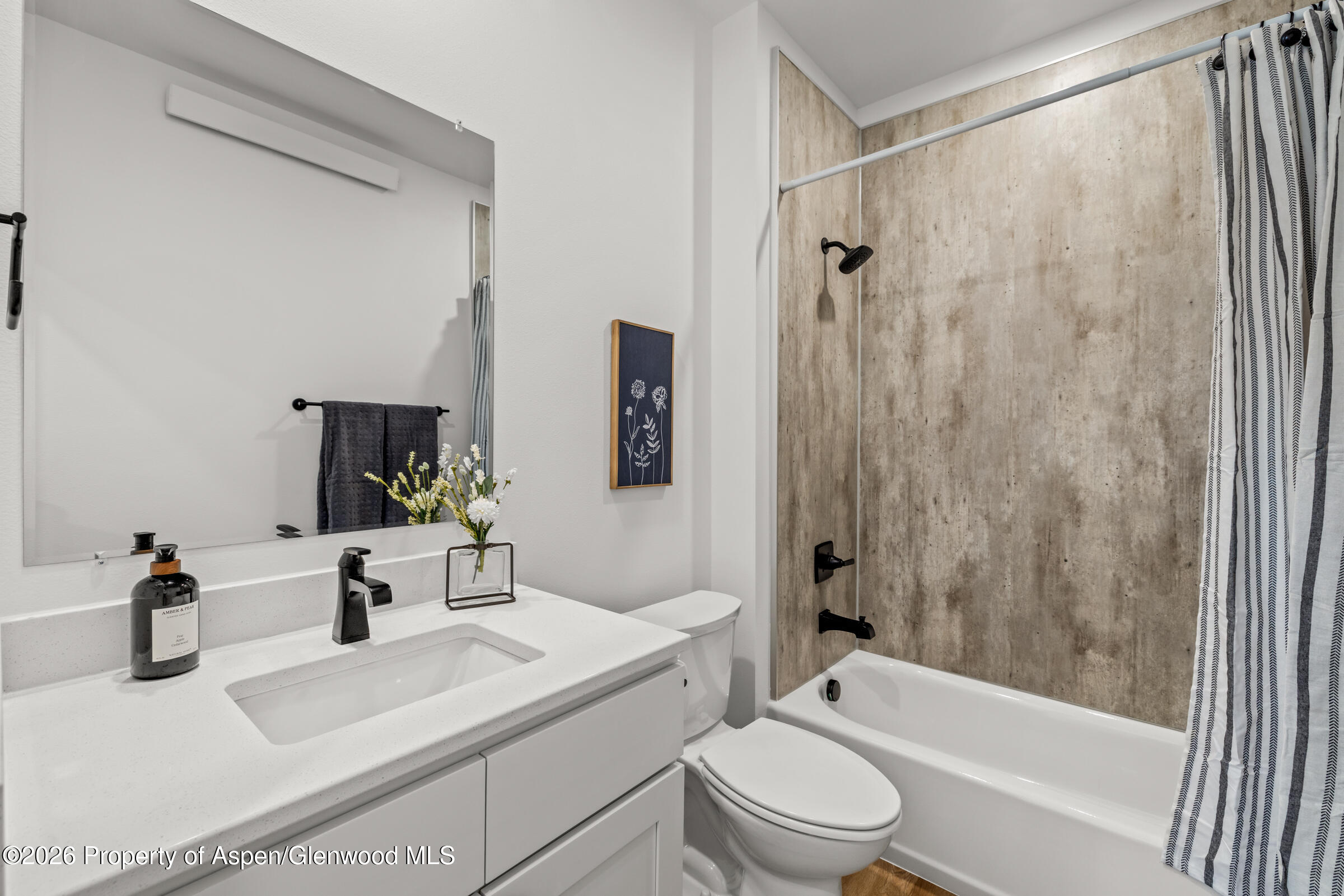 766 Tucker Street Craig, CO 81625 - Photo 11 of 22 a bathroom with a sink a toilet and shower