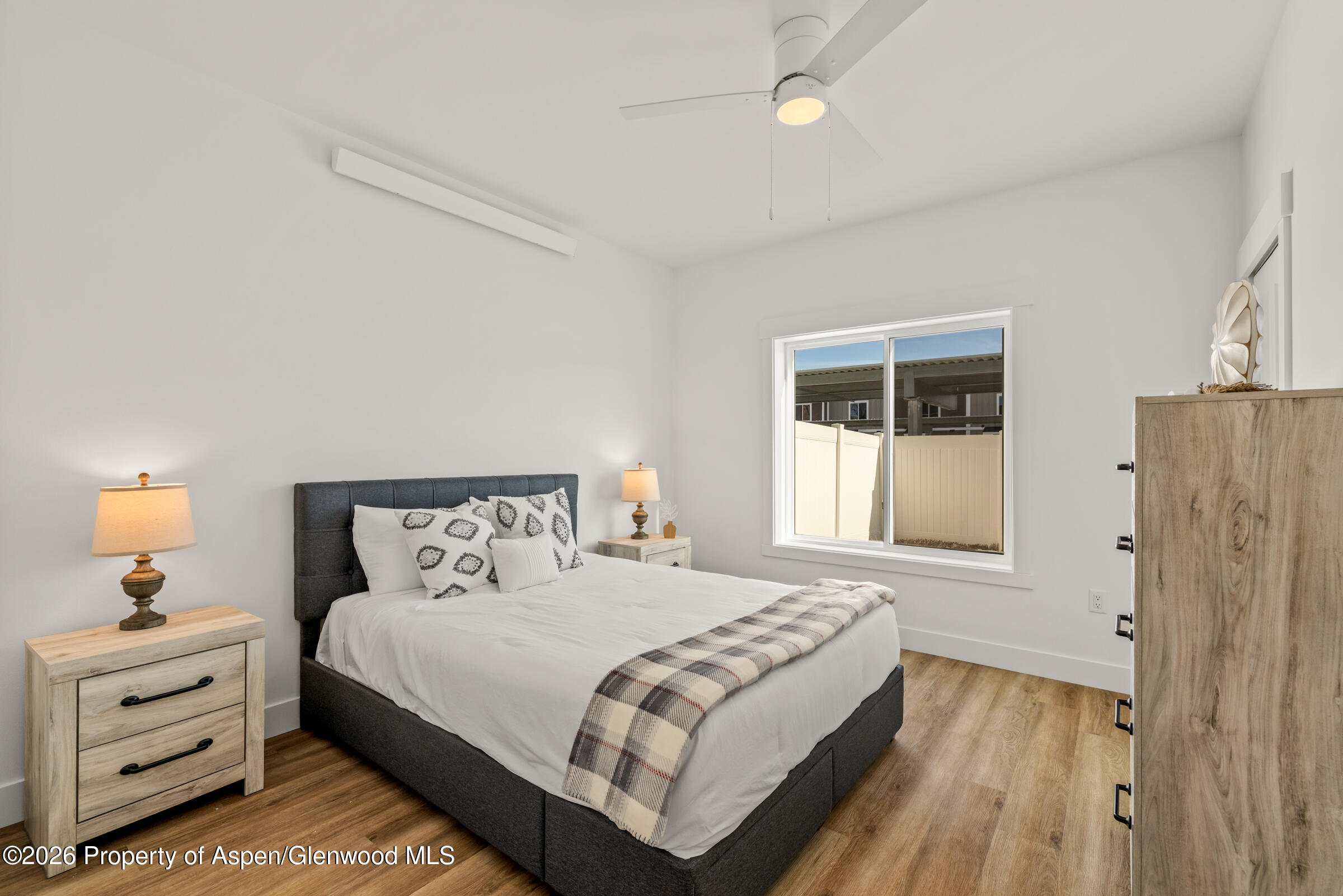 766 Tucker Street Craig, CO 81625 - Photo 12 of 22 a bedroom with a bed and a window