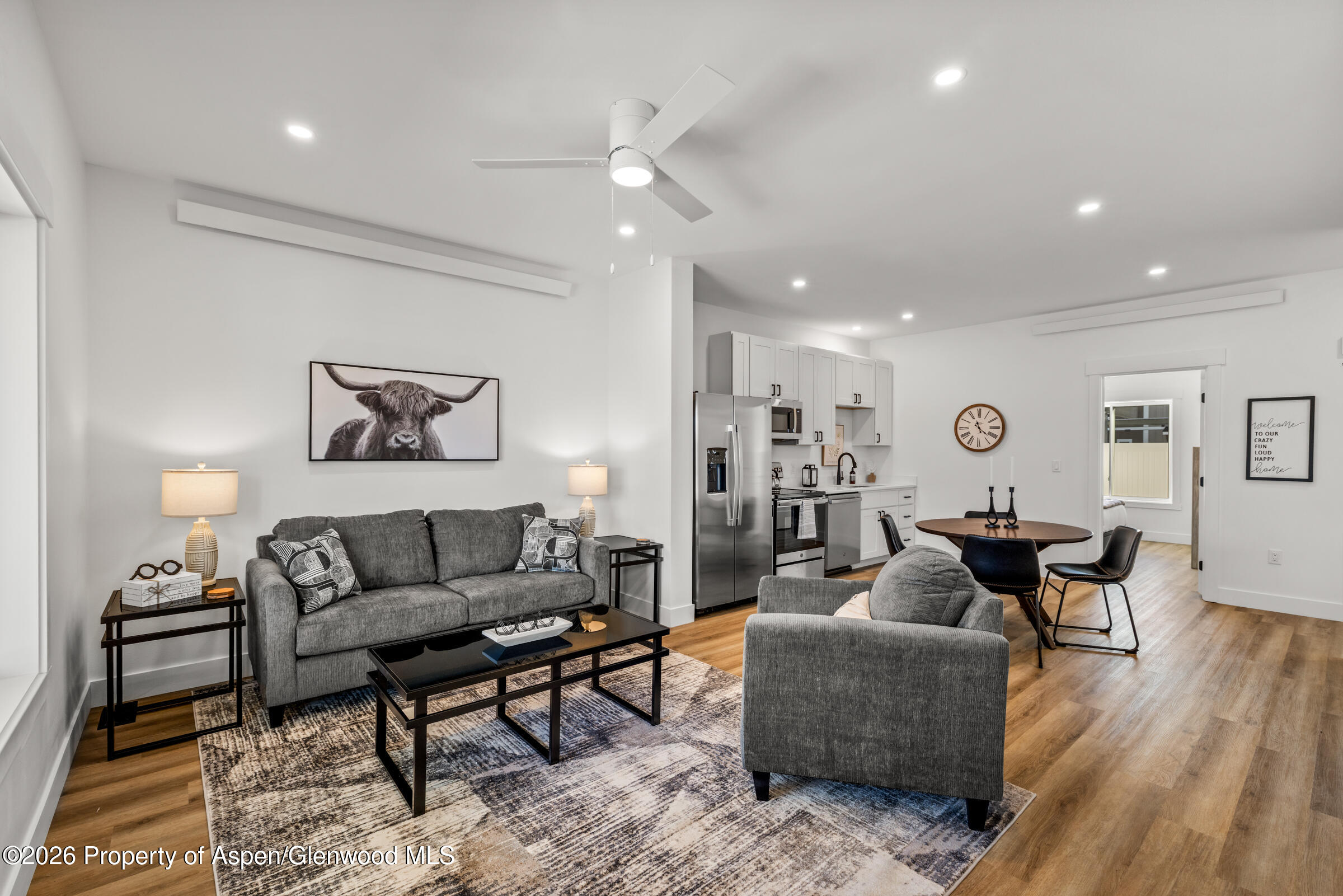 766 Tucker Street Craig, CO 81625 - Photo 3 of 22 a living room with furniture and wooden floor