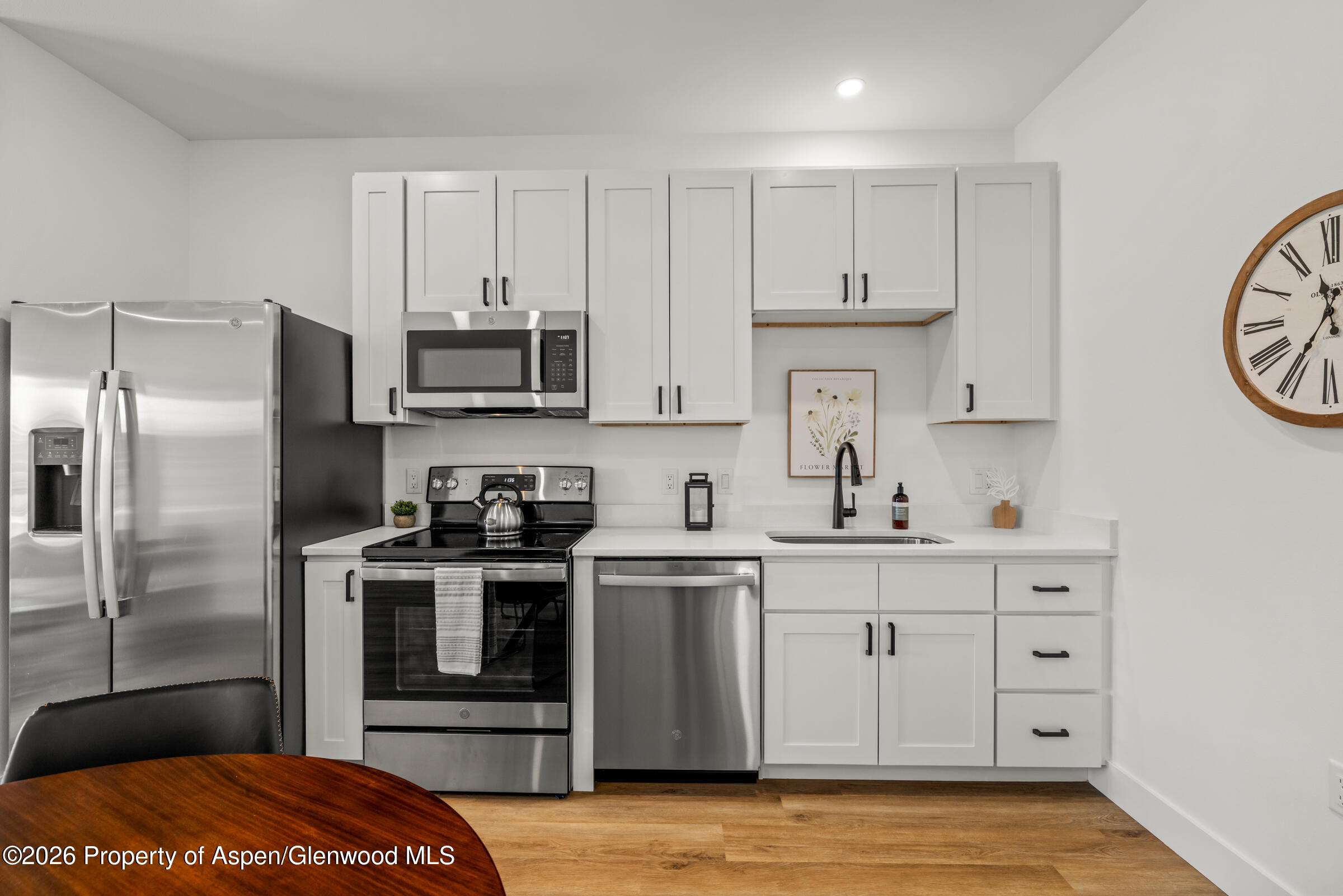 766 Tucker Street Craig, CO 81625 - Photo 6 of 22 a kitchen with stainless steel appliances a stove a refrigerator and a sink