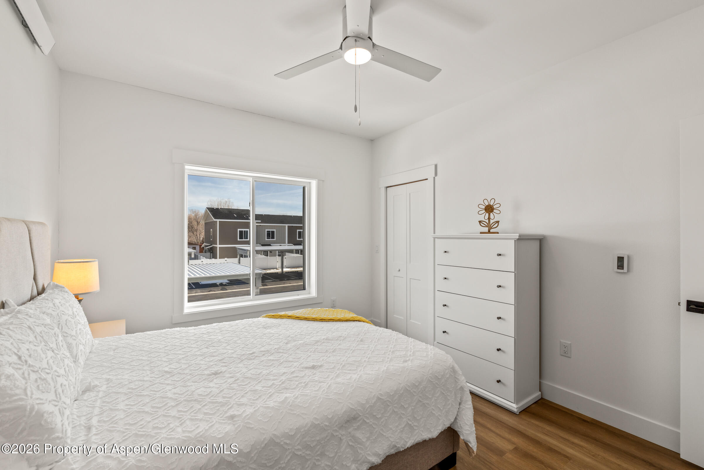 766 Tucker Street Craig, CO 81625 - Photo 9 of 22 a bedroom with a bed and a window