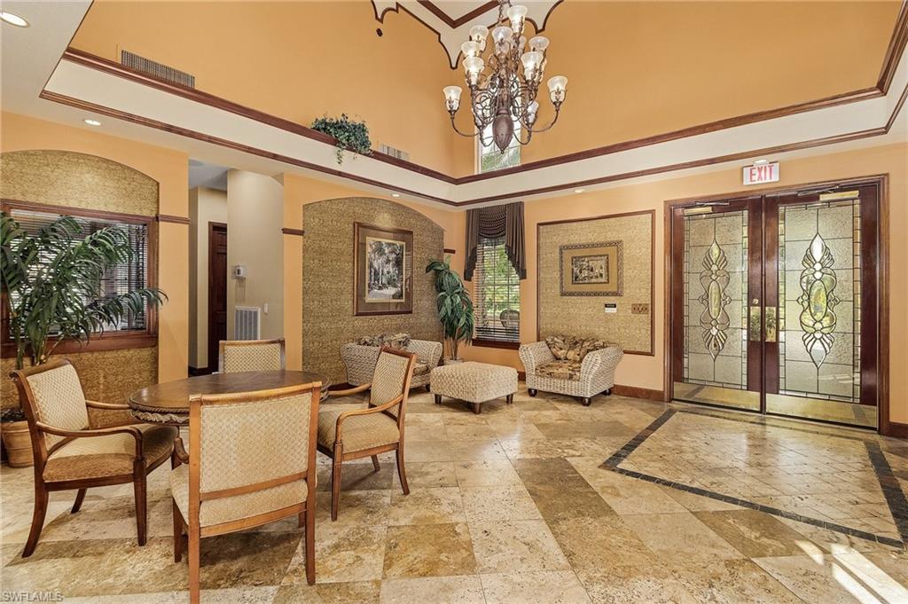 1180 Wildwood Lakes Boulevard, Unit 208 Naples, FL 34104 - Photo 11 of 19 a living room with furniture