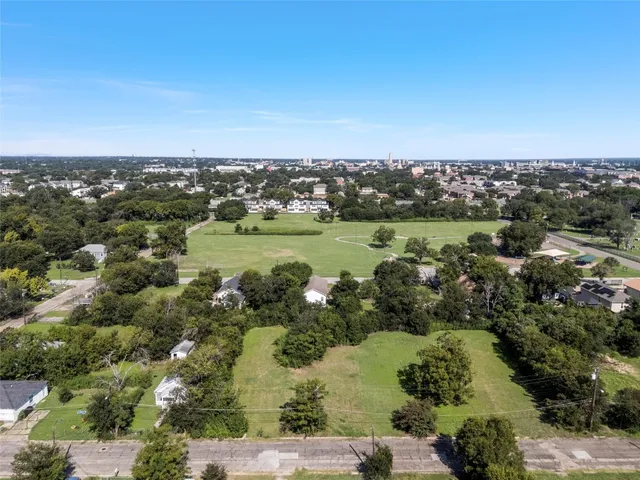 an aerial view of a houses with outdoor space