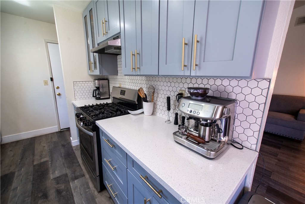 1 San Ramon Drive Chico, CA 95973 - Photo 10 of 42 a kitchen with a stove and a white cabinets