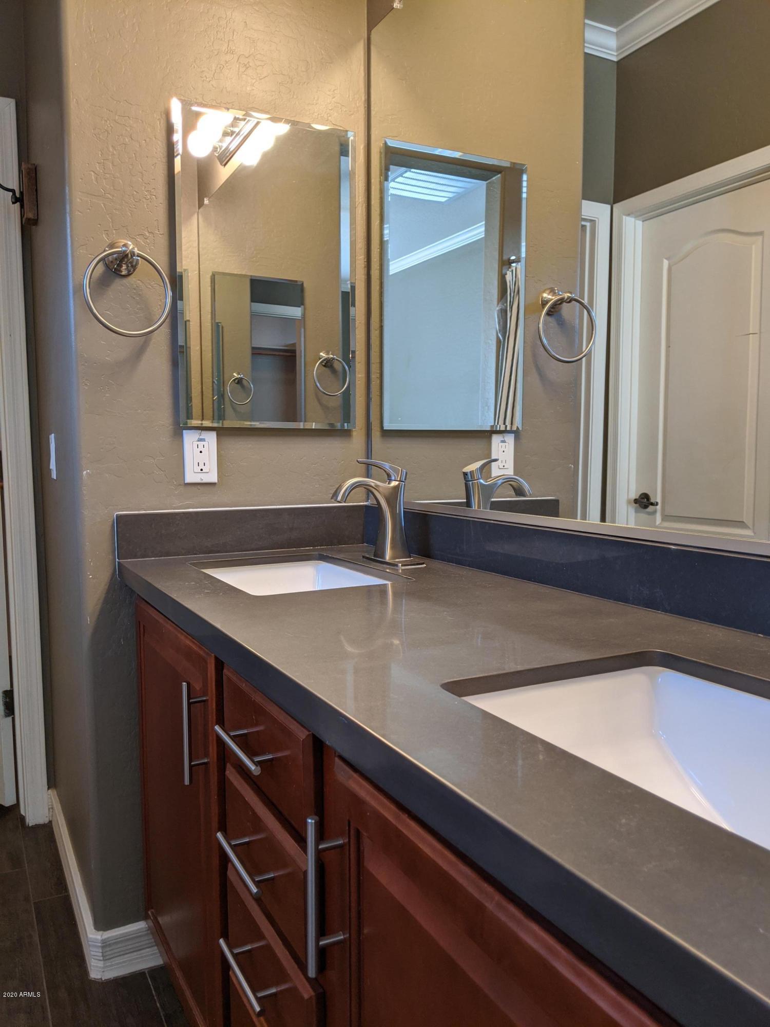 21019 East Avenida Del Valle Queen Creek, AZ 85142 - Photo 15 of 52 a bathroom with a sink and a mirror