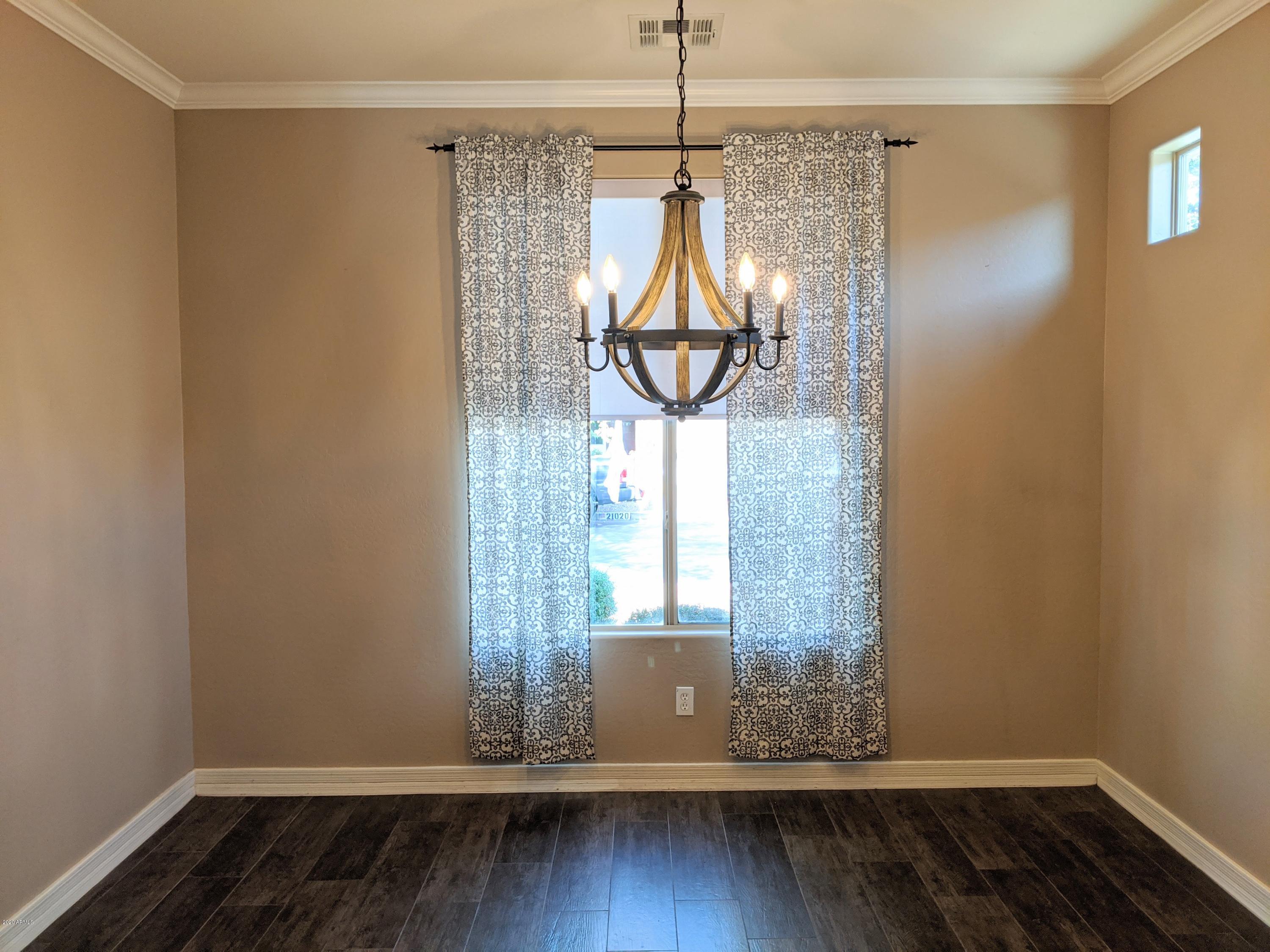 21019 East Avenida Del Valle Queen Creek, AZ 85142 - Photo 24 of 52 a view of empty room with wooden floor and fan