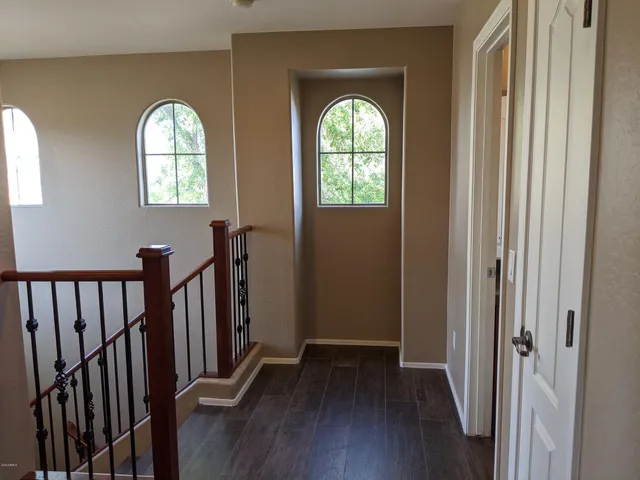 a view of a livingroom with a chandelier fan