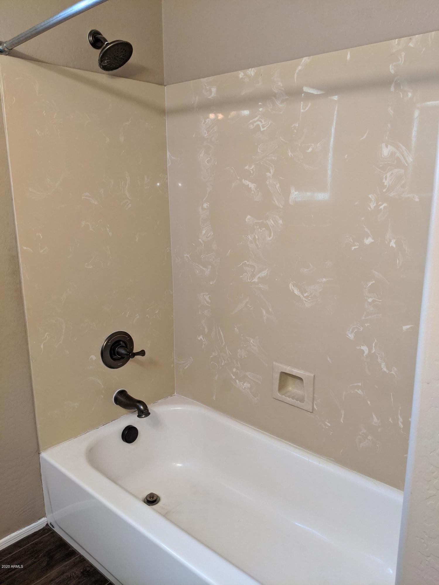 21019 East Avenida Del Valle Queen Creek, AZ 85142 - Photo 37 of 52 a bathroom with a bathtub and shower