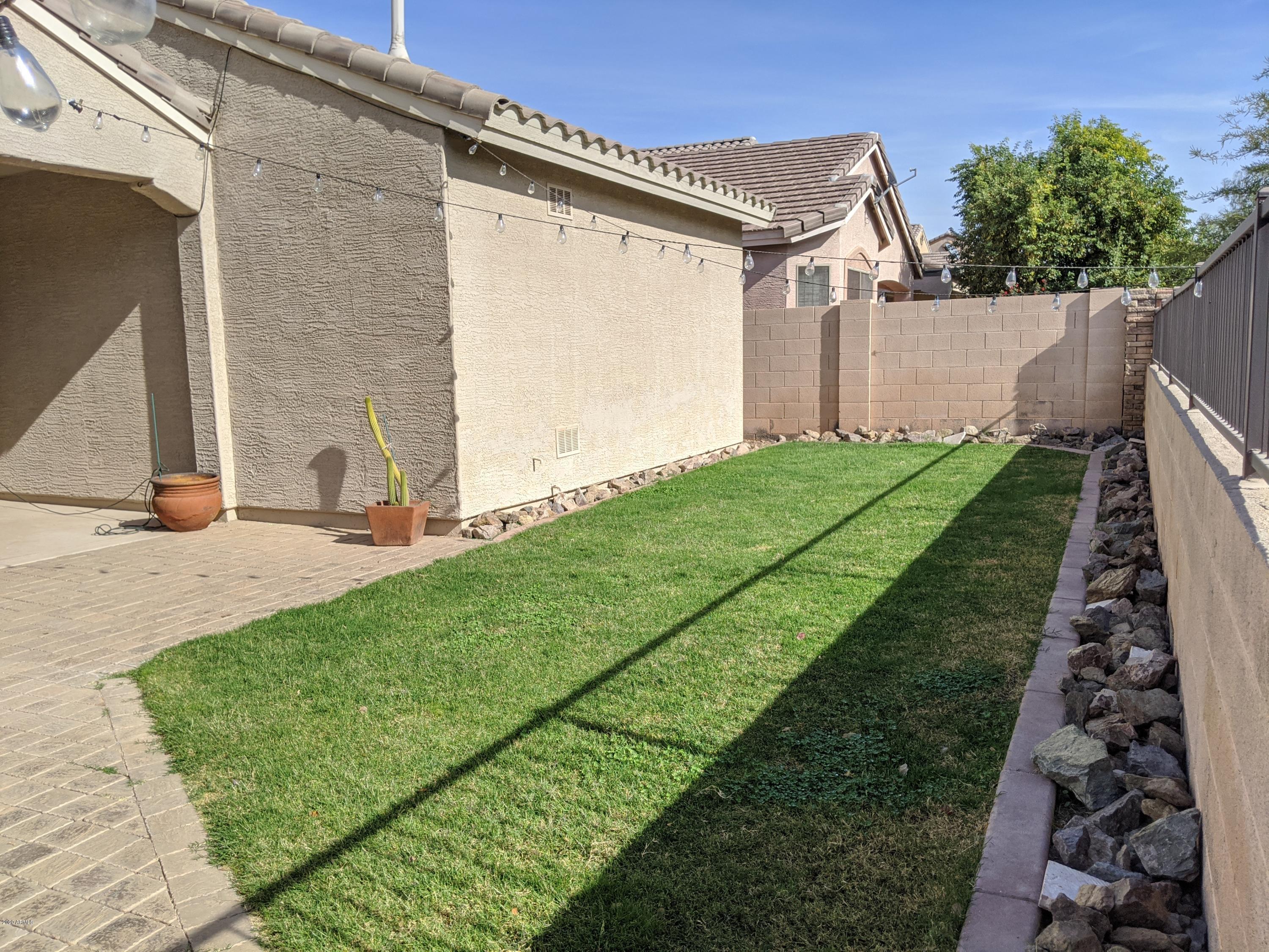 21019 East Avenida Del Valle Queen Creek, AZ 85142 - Photo 41 of 52 a view of a back yard of the house