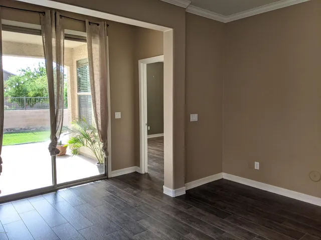 a view of room with wooden floor