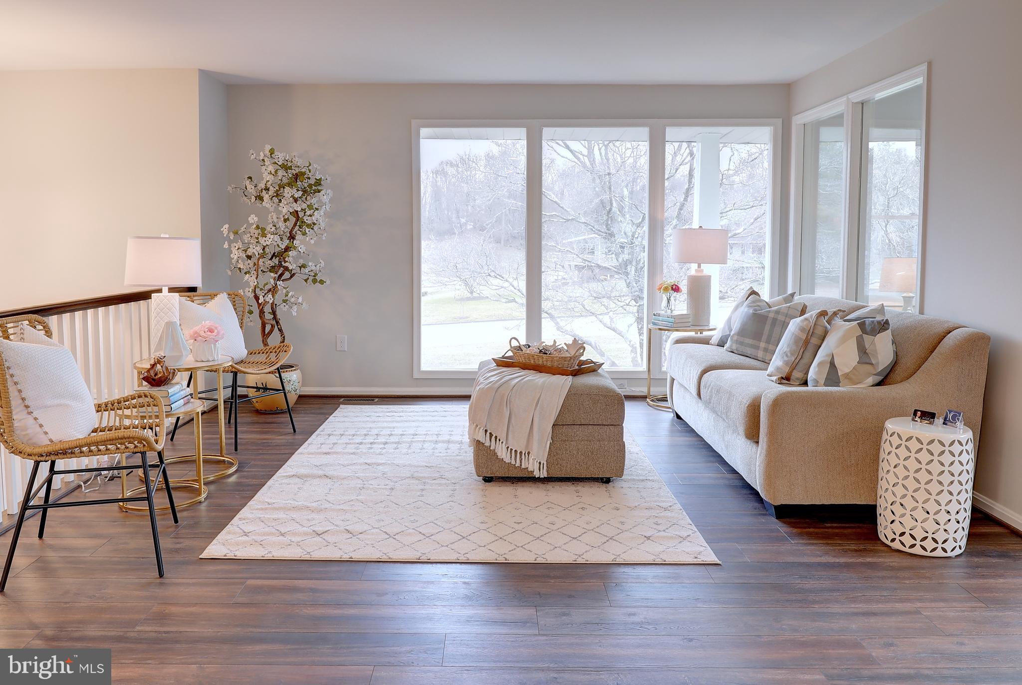 695 Hillmeade Road Edgewater, MD 21037 - Photo 3 of 28 a living room with furniture and a wooden floor