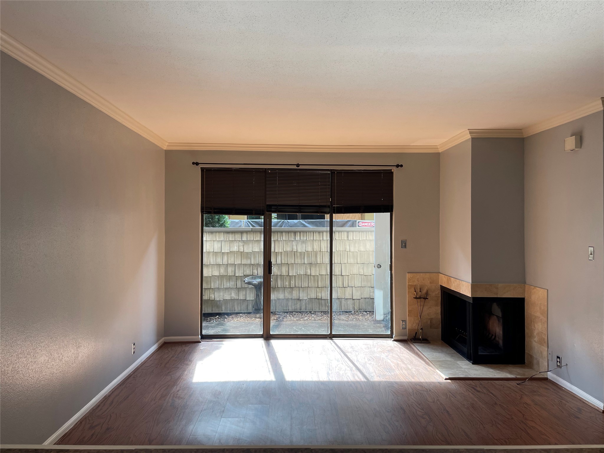 2829 Timmons Lane, Unit 215 Houston, TX 77027 - Photo 12 of 13 wooden floor in an empty room with a window